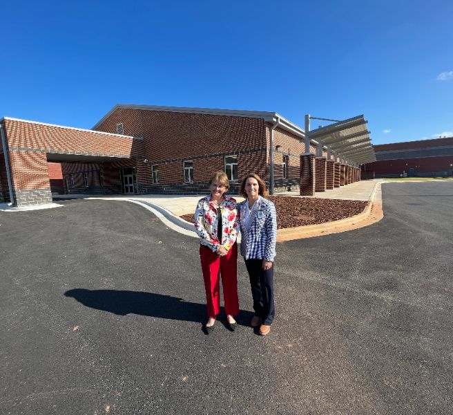  Bob Jones principal shown with Special Education Director in front of the new  BJ special ed wing